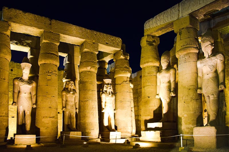 Ancient stone monuments lit at night
